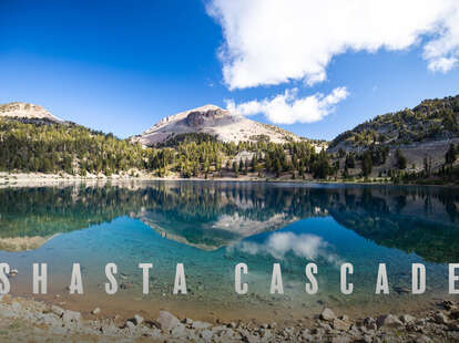 a large lake in front of a mountain
