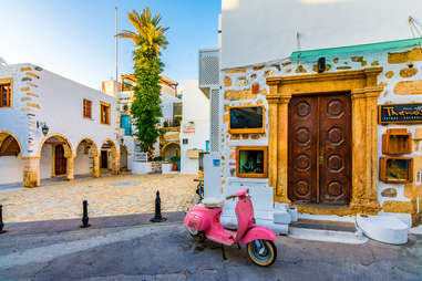 pink scooter street view, patmos, greece