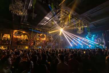 interior of the fillmore concert venue in san francisco during a concert, with a big crowd