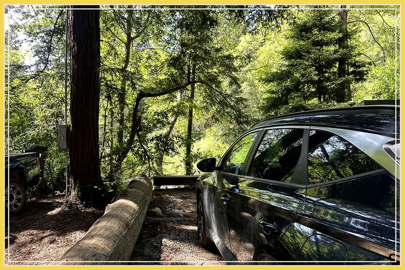 a car pulled into a parking spot at a campground in big sur, california