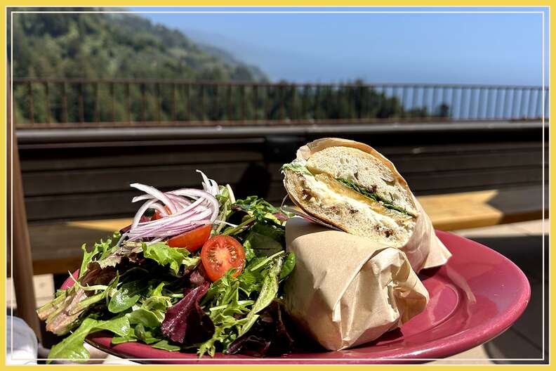 a sandwich on the deck with a big view at cafe kevah connected to nepenthe restaurant in big sur